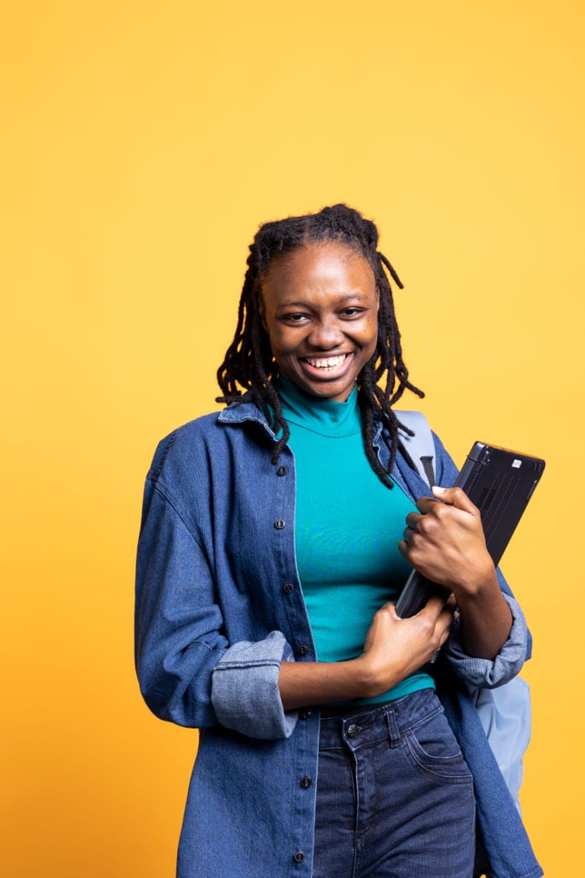 Student holding a laptop
